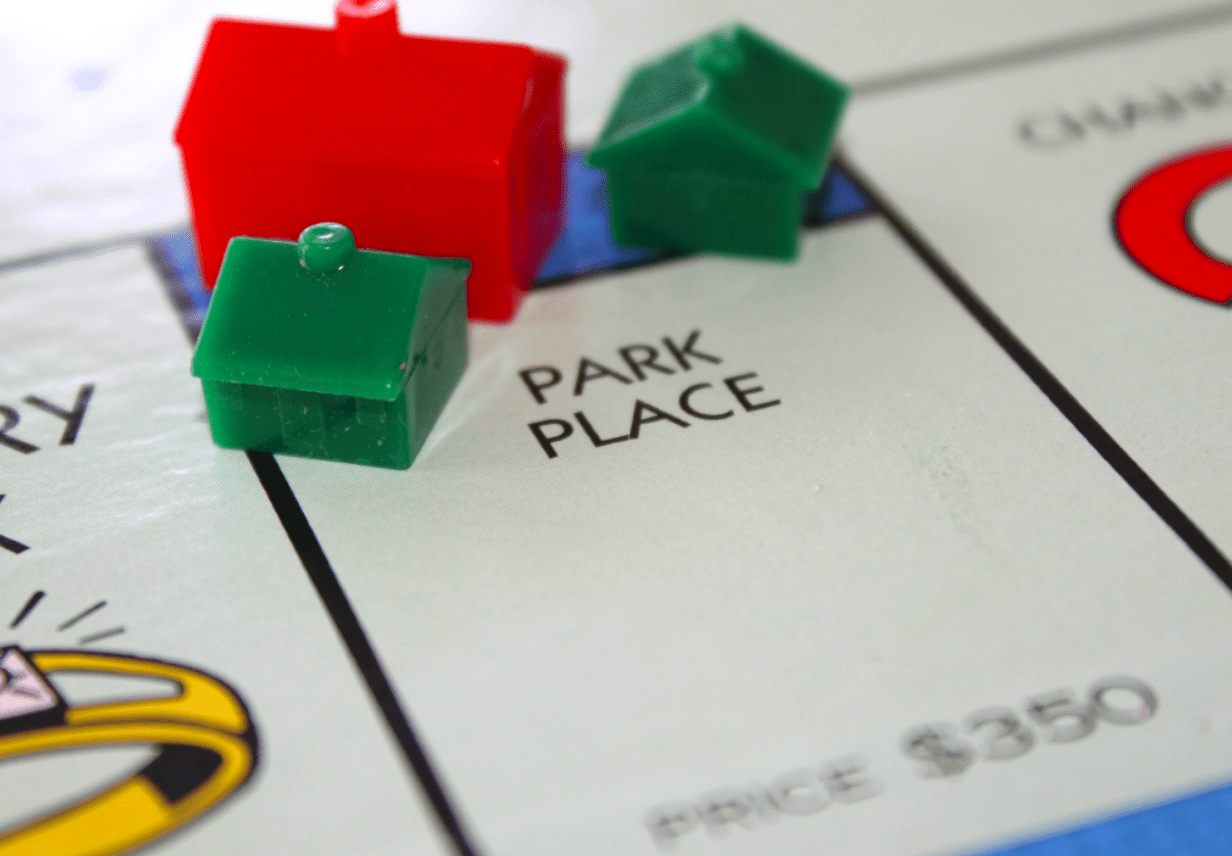 Monopoly game representing single family residence and multi-family building