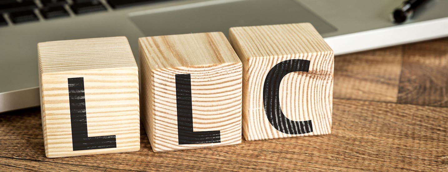 Wood blocks with the letters LLC
